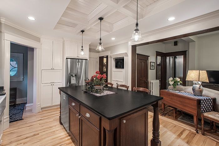 There is a large island in the middle of the kitchen.