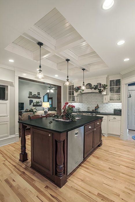 There is a large island in the middle of the kitchen.