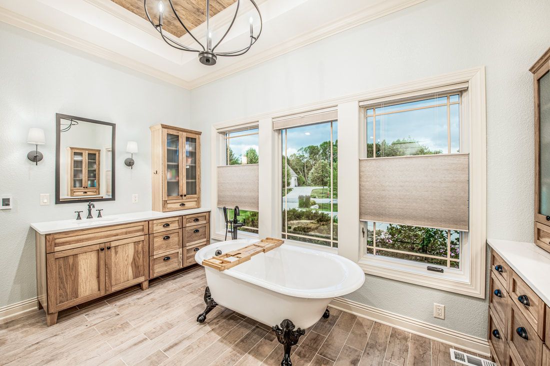 There is a bathtub in the middle of the bathroom.
