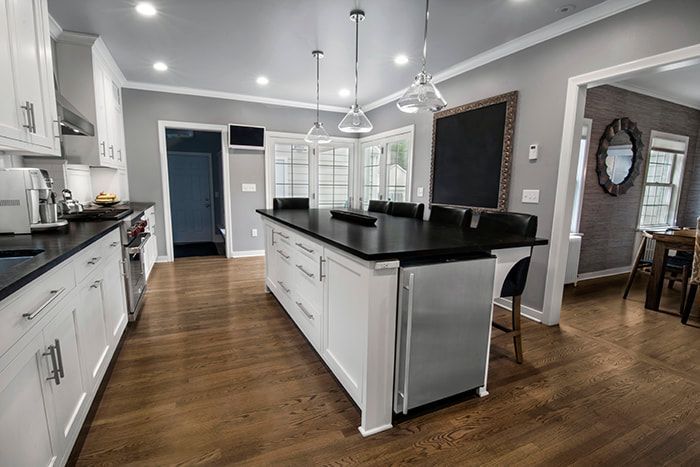 A kitchen with a large island in the middle of the room.
