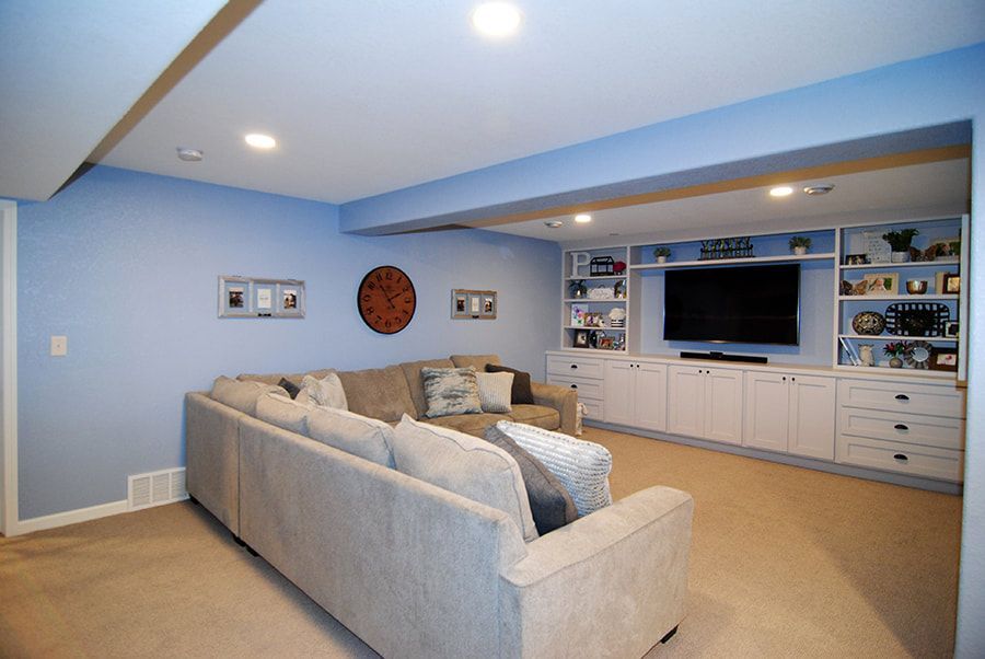A living room with a couch and a flat screen tv