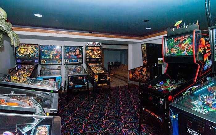 A room filled with pinball machines and arcade games.