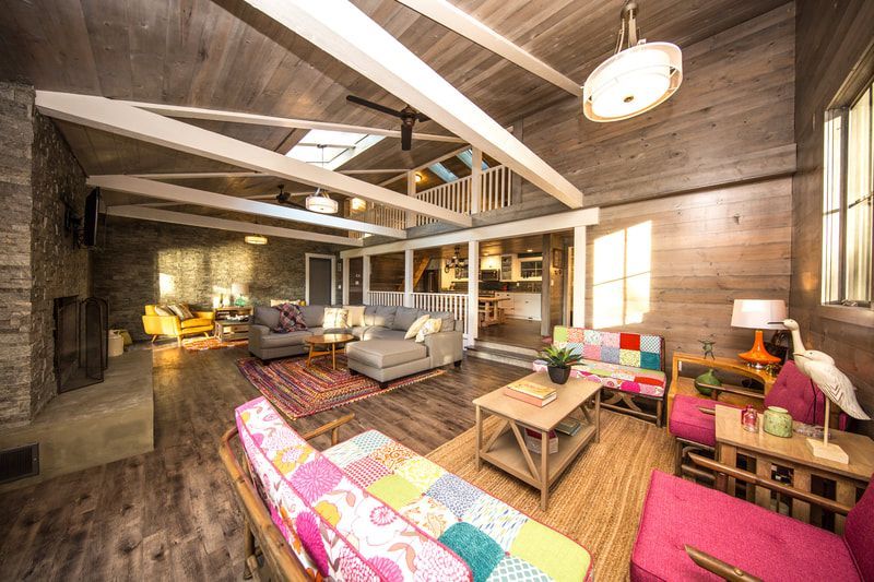 A living room filled with furniture and a fireplace.