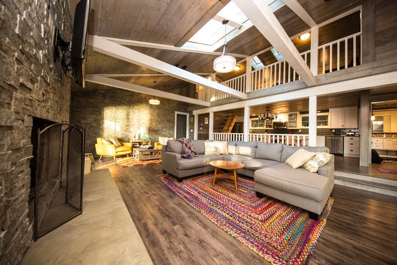 A living room filled with furniture and a fireplace.