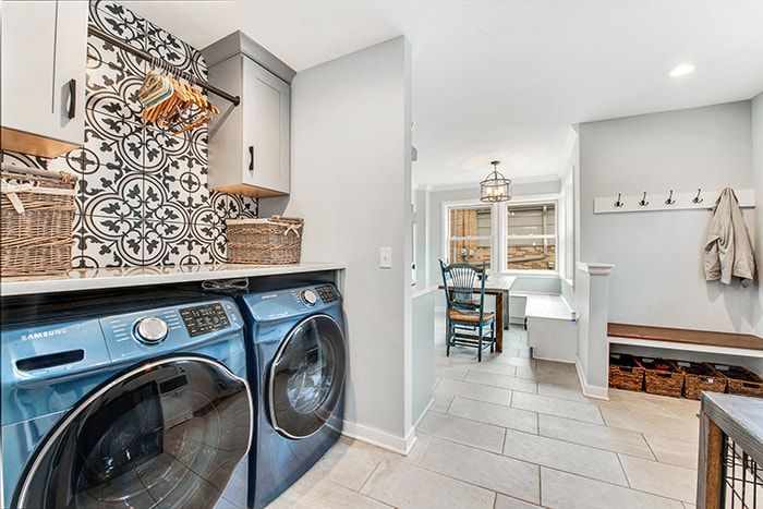 A laundry room with a washer and dryer in it.