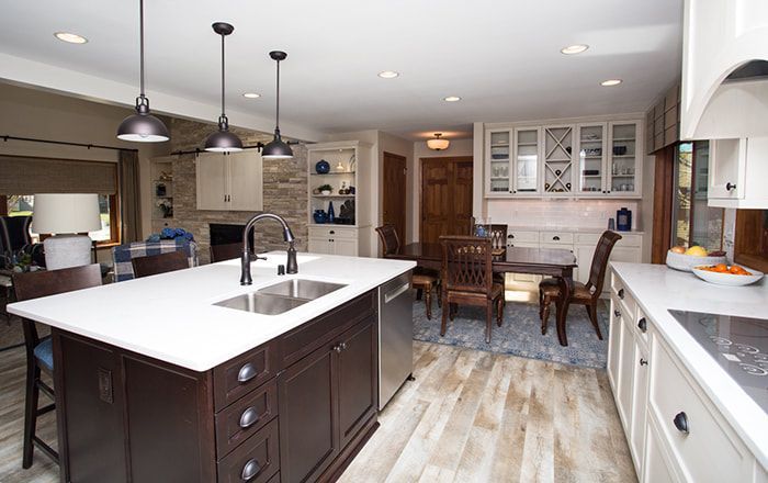 A kitchen with a large island and a sink