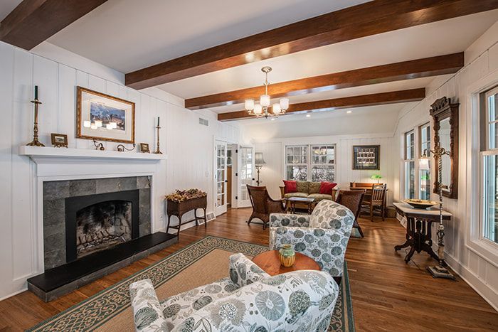 A living room filled with furniture and a fireplace.