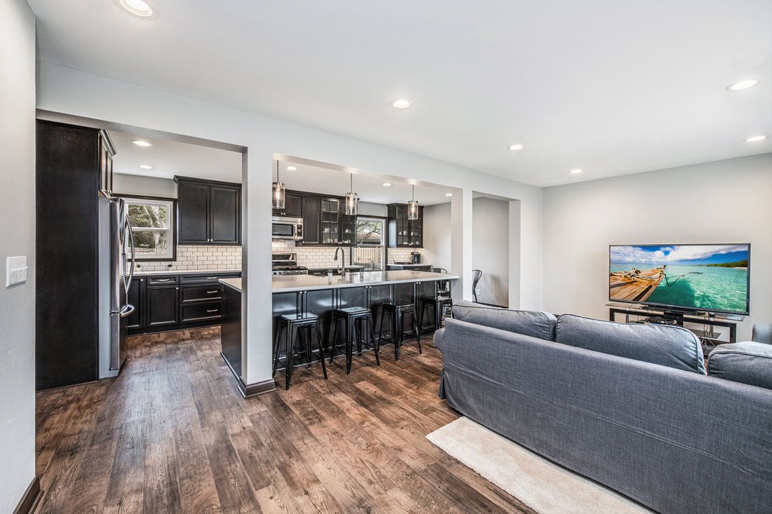 A living room filled with furniture and a flat screen tv.