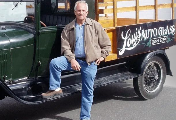 Owner with the vintage company truck