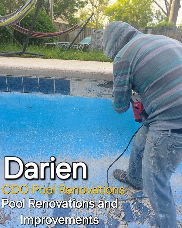 A man in a hoodie is working on a pool