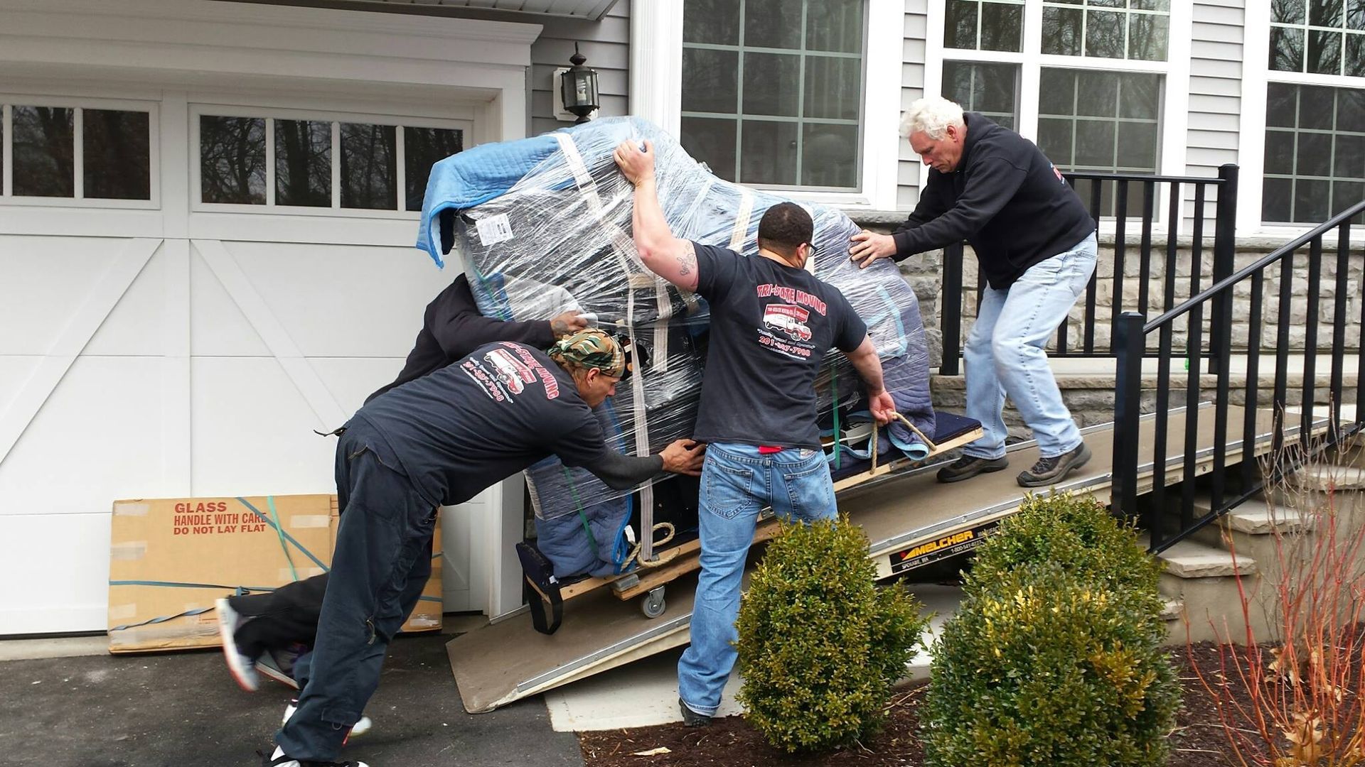 men moving piano