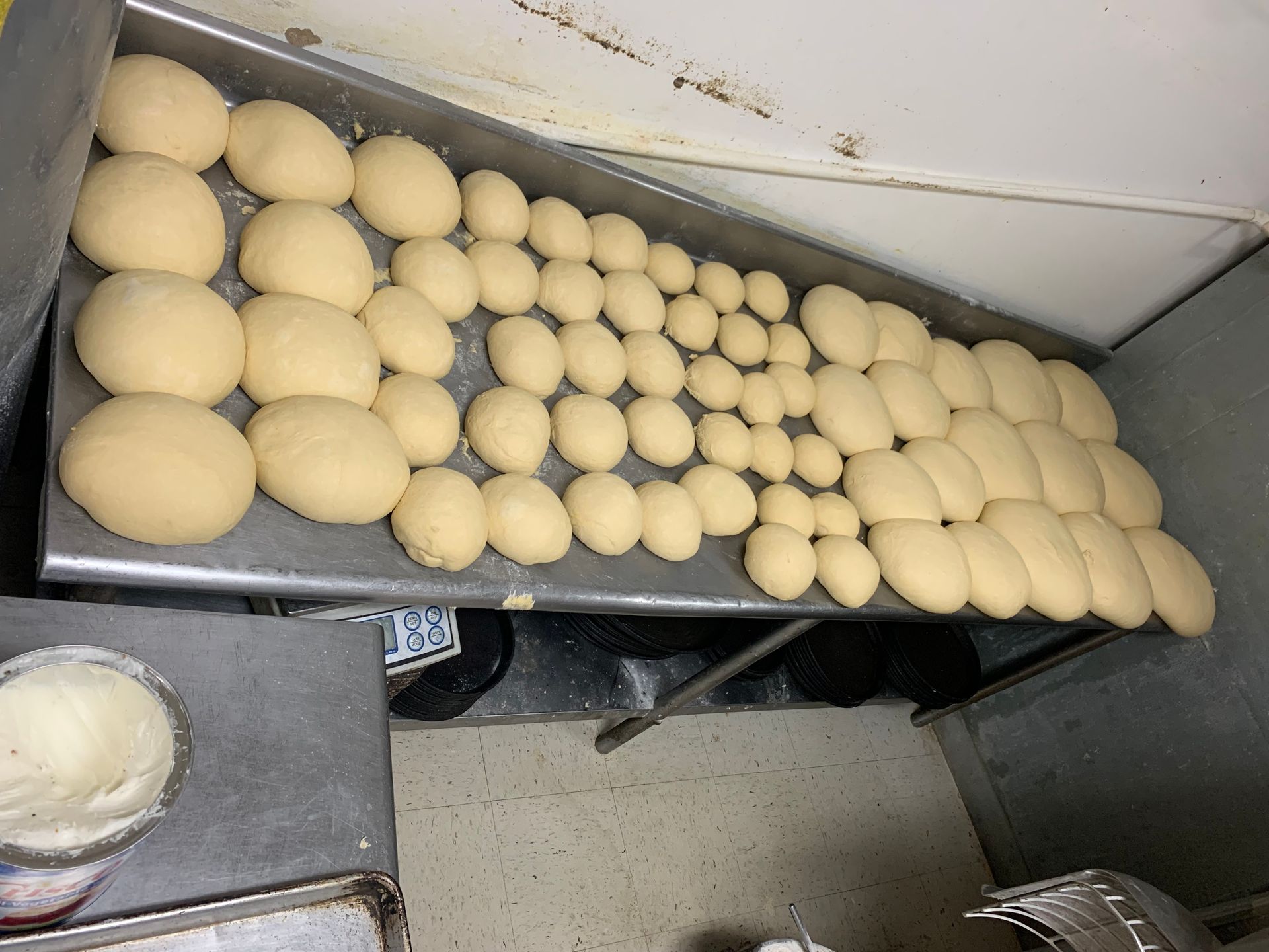 A bunch of dough balls are sitting on a table