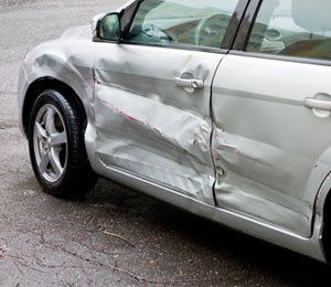 Damaged silver car
