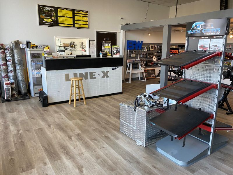 A line x store with a counter and a stool