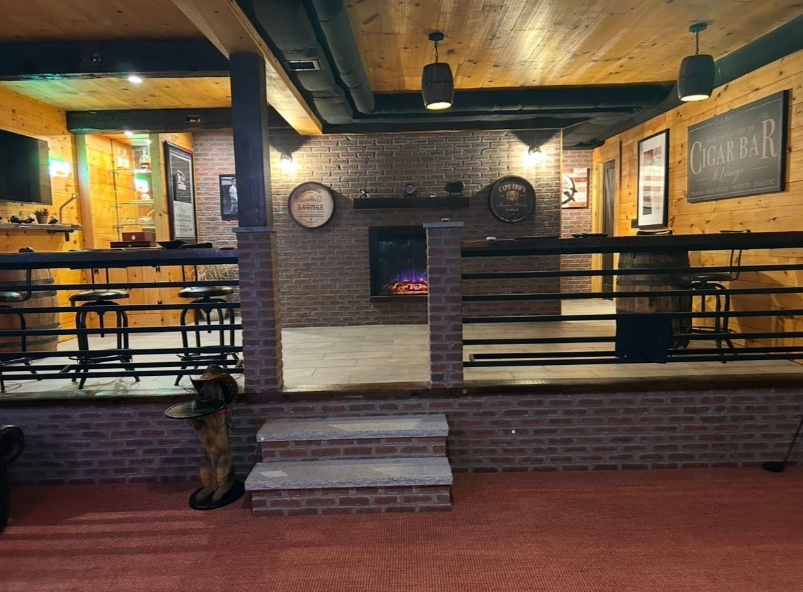 There is a fireplace in the middle of the room.