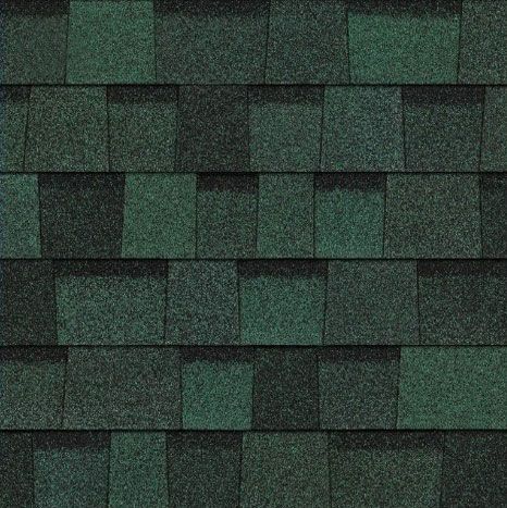 A close up of a roof with green shingles.