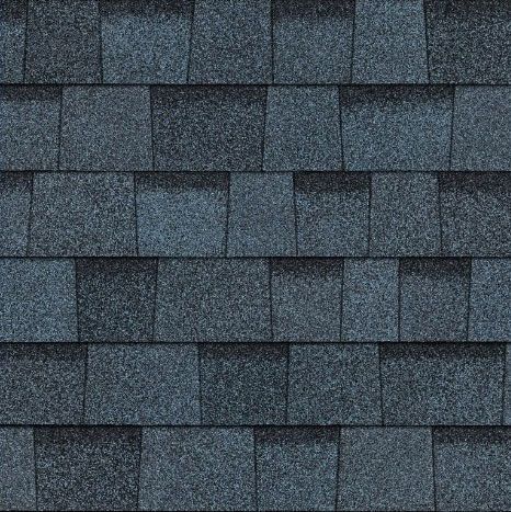 A close up of a row of blue shingles on a roof.