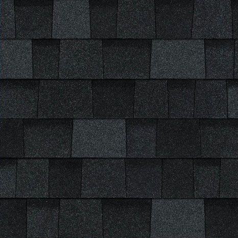 A close up of a row of black shingles on a roof.