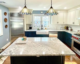 a kitchen with granite countertops