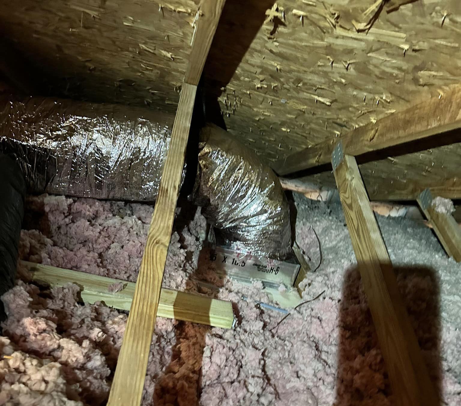 There is a duct in the ceiling of a house.