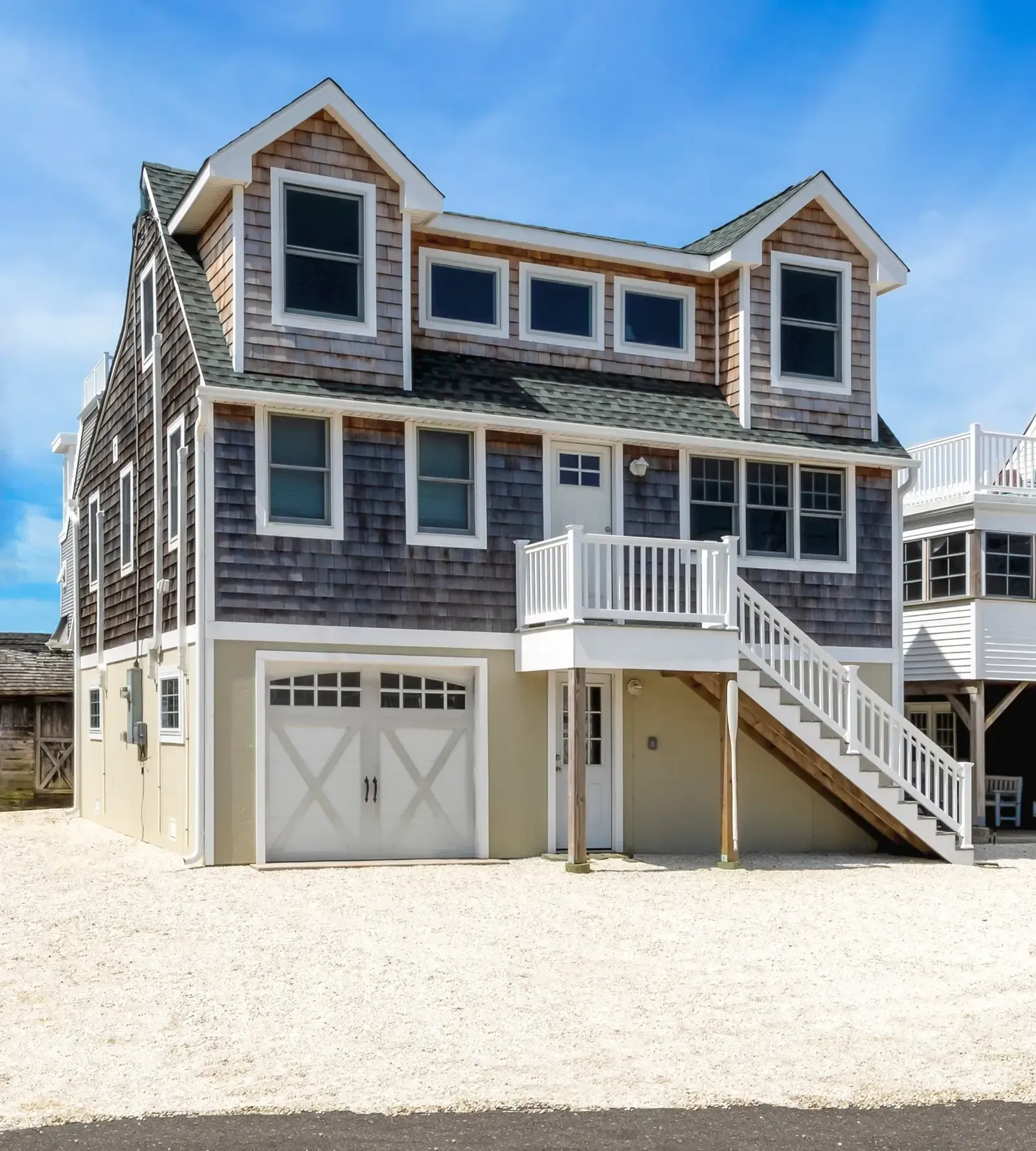 A large house with stairs leading up to the second floor