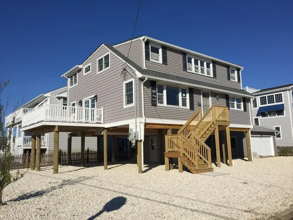 A large house with stairs leading up to the second floor