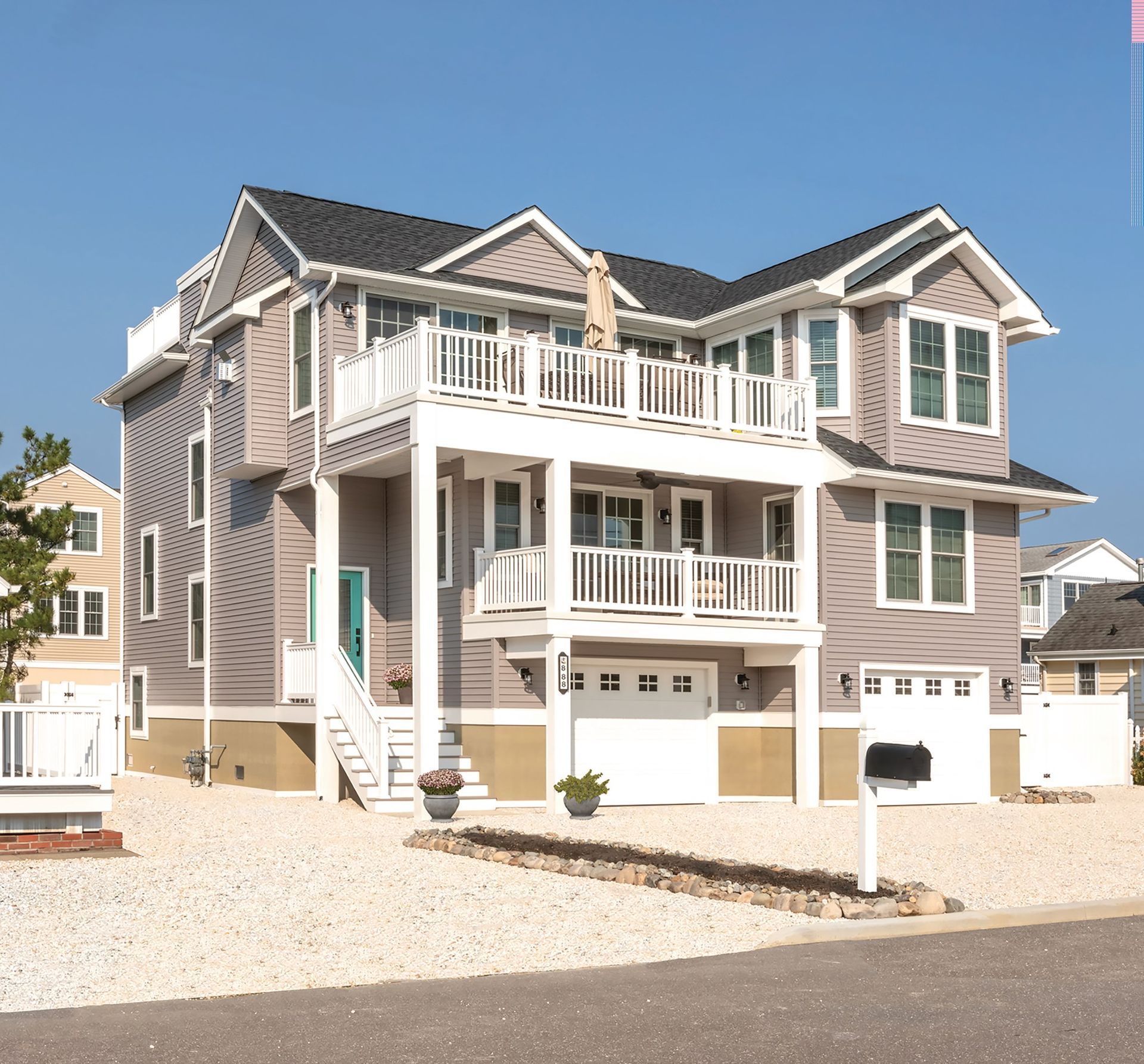 A large house with a mailbox in front of it