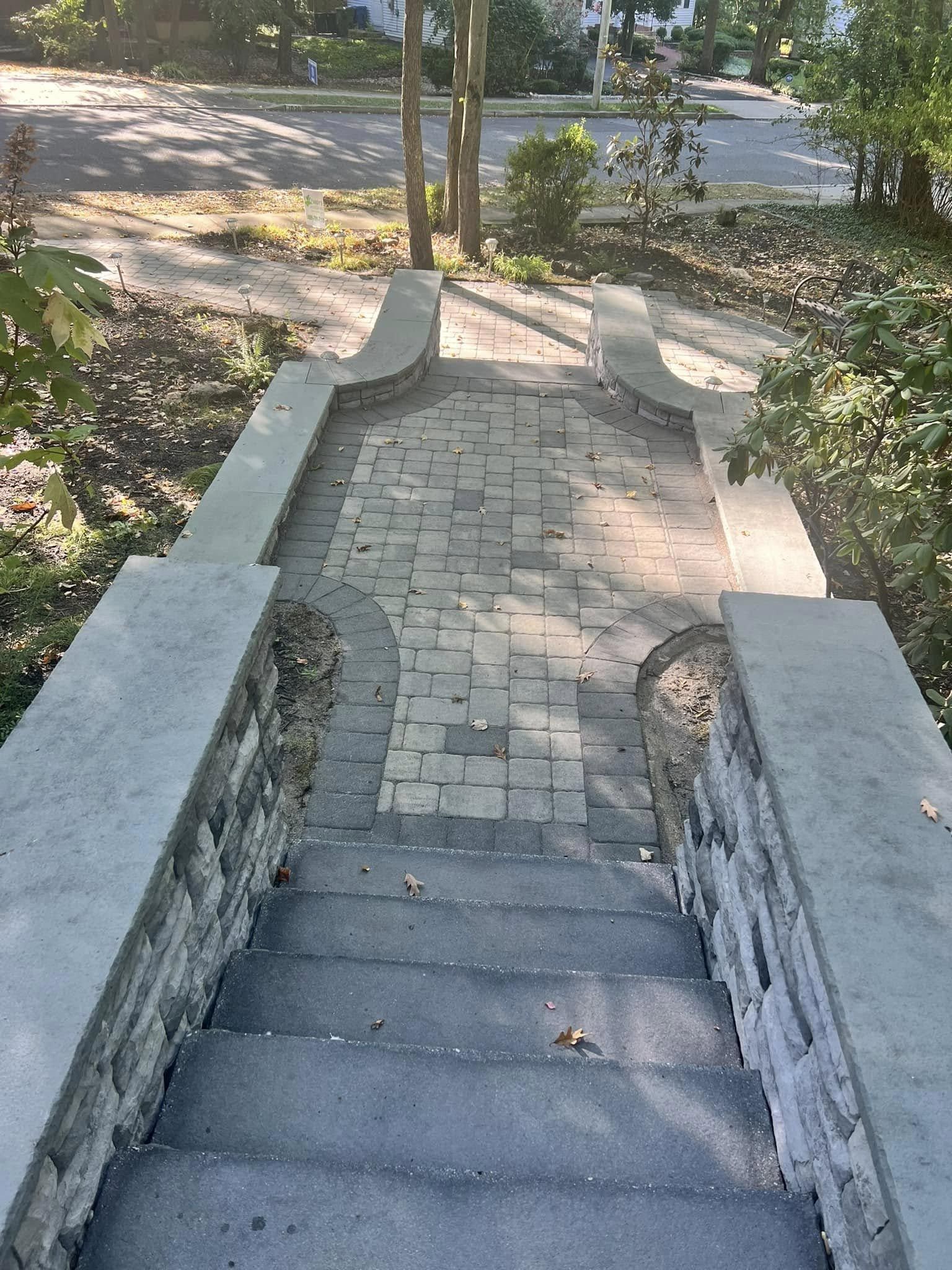 A set of stairs leading up to a stone walkway.