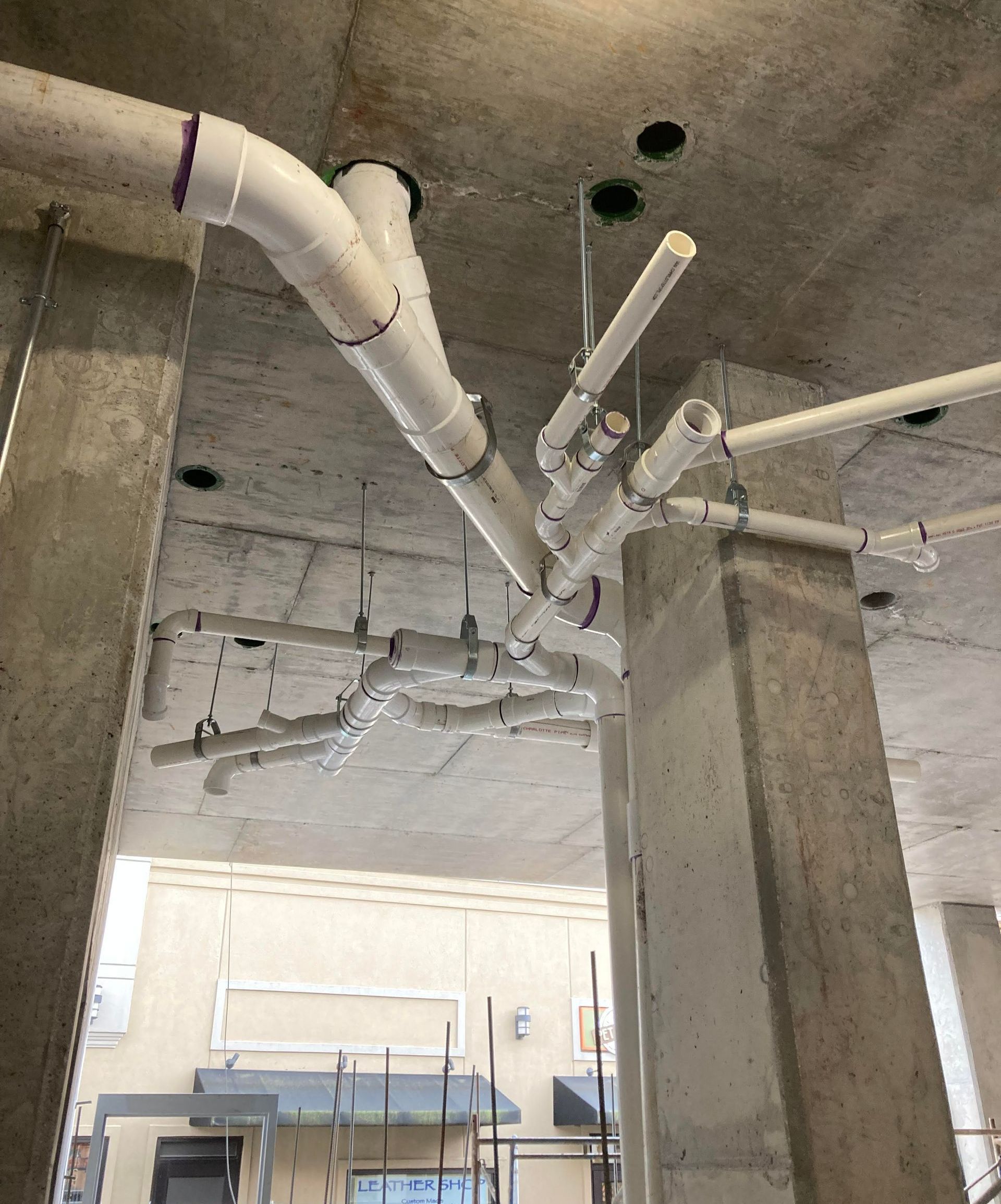 PVC waste line, held up by suspensions. Known as