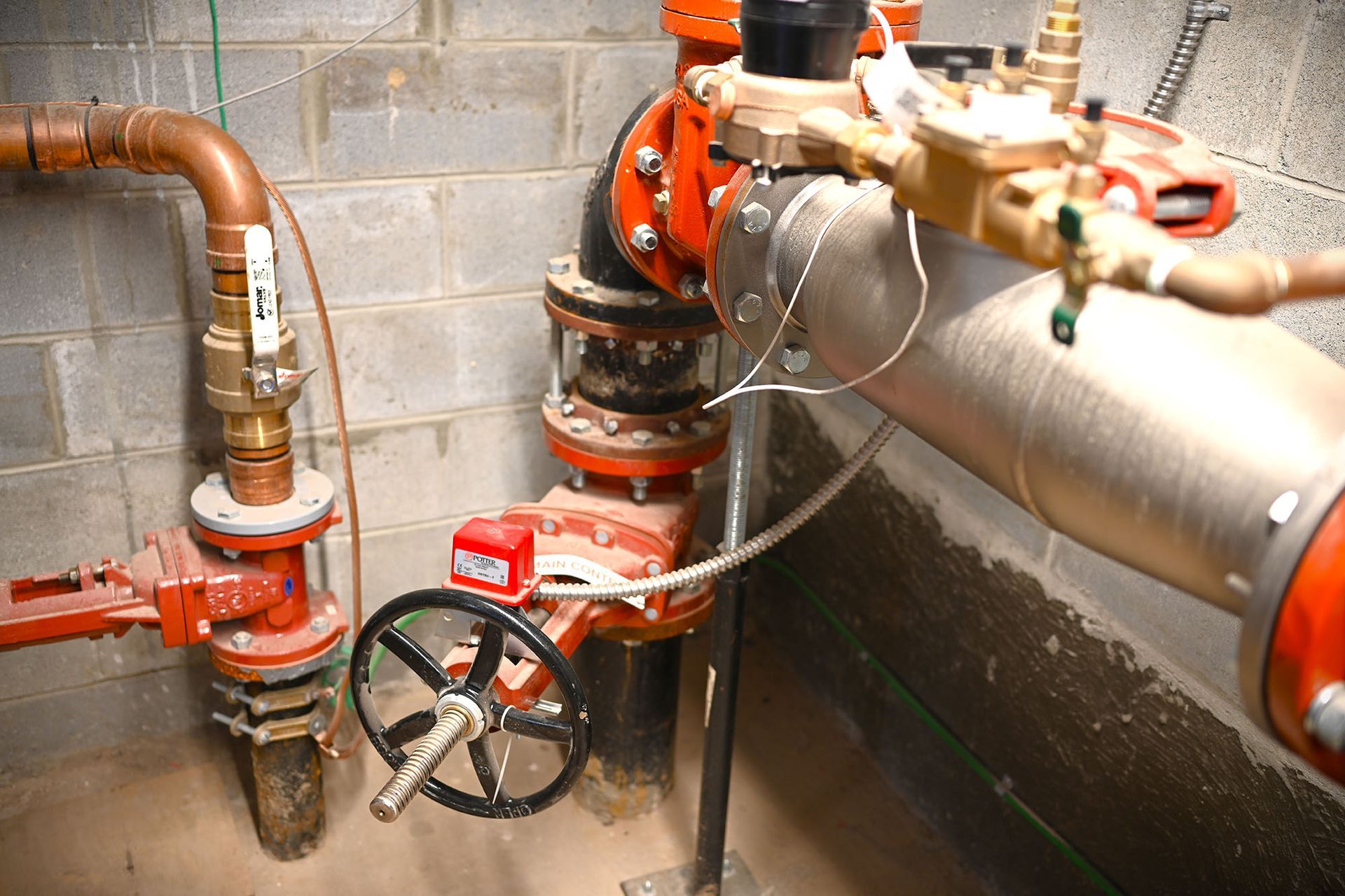 A room with a lot of pipes and valves