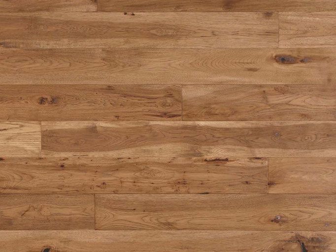 Light brown hardwood floor with knots and wood grain.