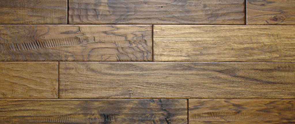 Wooden floorboards, medium brown with dark brown knots and grains.