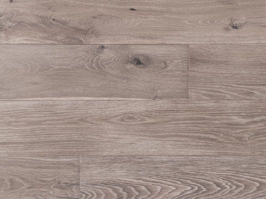 Wooden floorboards in shades of light brown and gray, with visible wood grain and knots.
