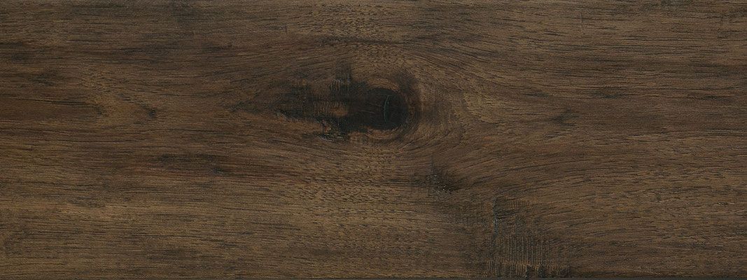 Dark brown wood grain texture.