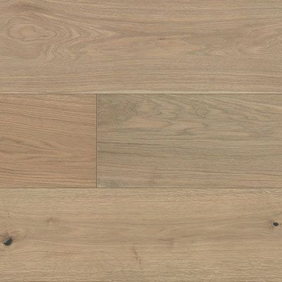 Light brown hardwood flooring with natural wood grain and knots.
