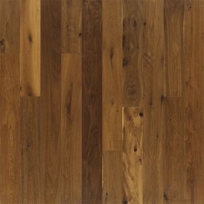 Wood floor with varying shades of brown planks, showing knots and grain.