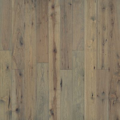 Light brown, weathered hardwood floor with varying wood grain and knots.