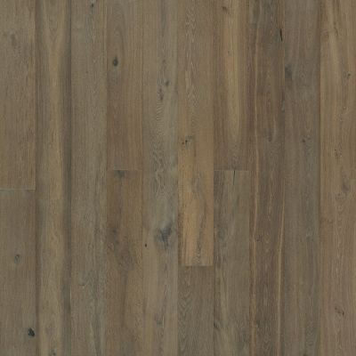 Wood floor planks in varying shades of brown and gray with visible grain and knots.
