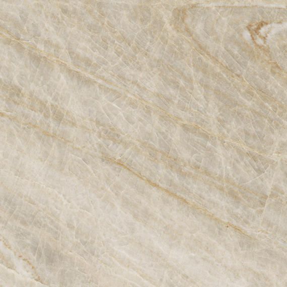 A close-up of beige marble with subtle white veining and warm, swirling mineral patterns.