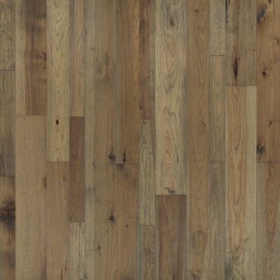Wooden floor with various shades of brown and natural wood grain patterns.