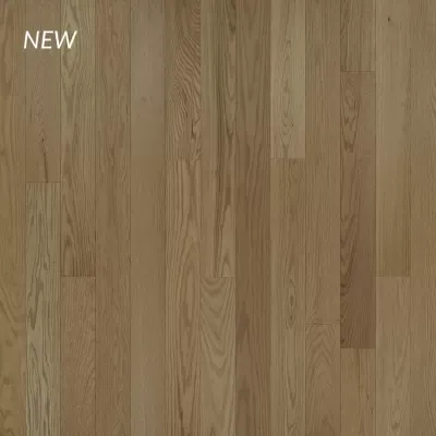 Wooden plank flooring in a natural light brown color with visible wood grain and the word