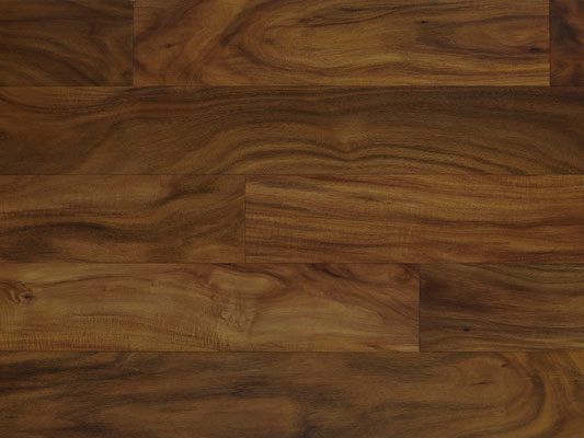 Close-up of hardwood flooring; warm brown with prominent wood grain patterns.