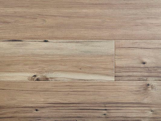 Wooden flooring, medium brown with natural grain and knots.