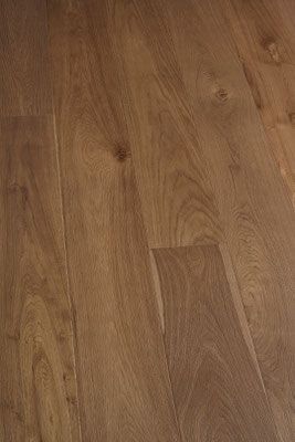 Wooden floorboards, light brown with visible wood grain and knots.