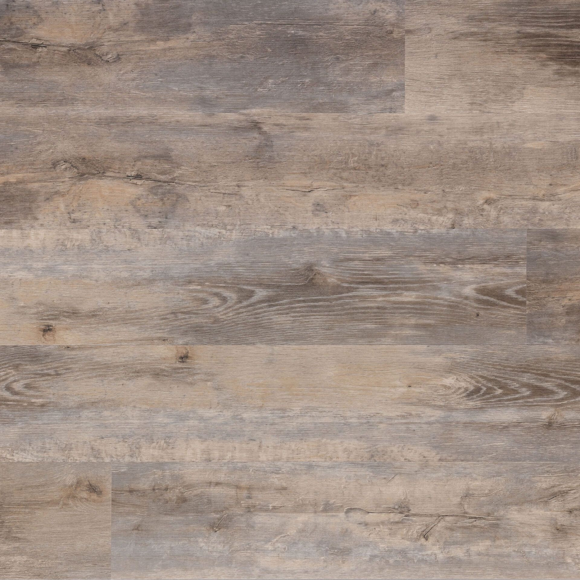 Close-up of wood-look flooring with varying shades of brown and gray planks.