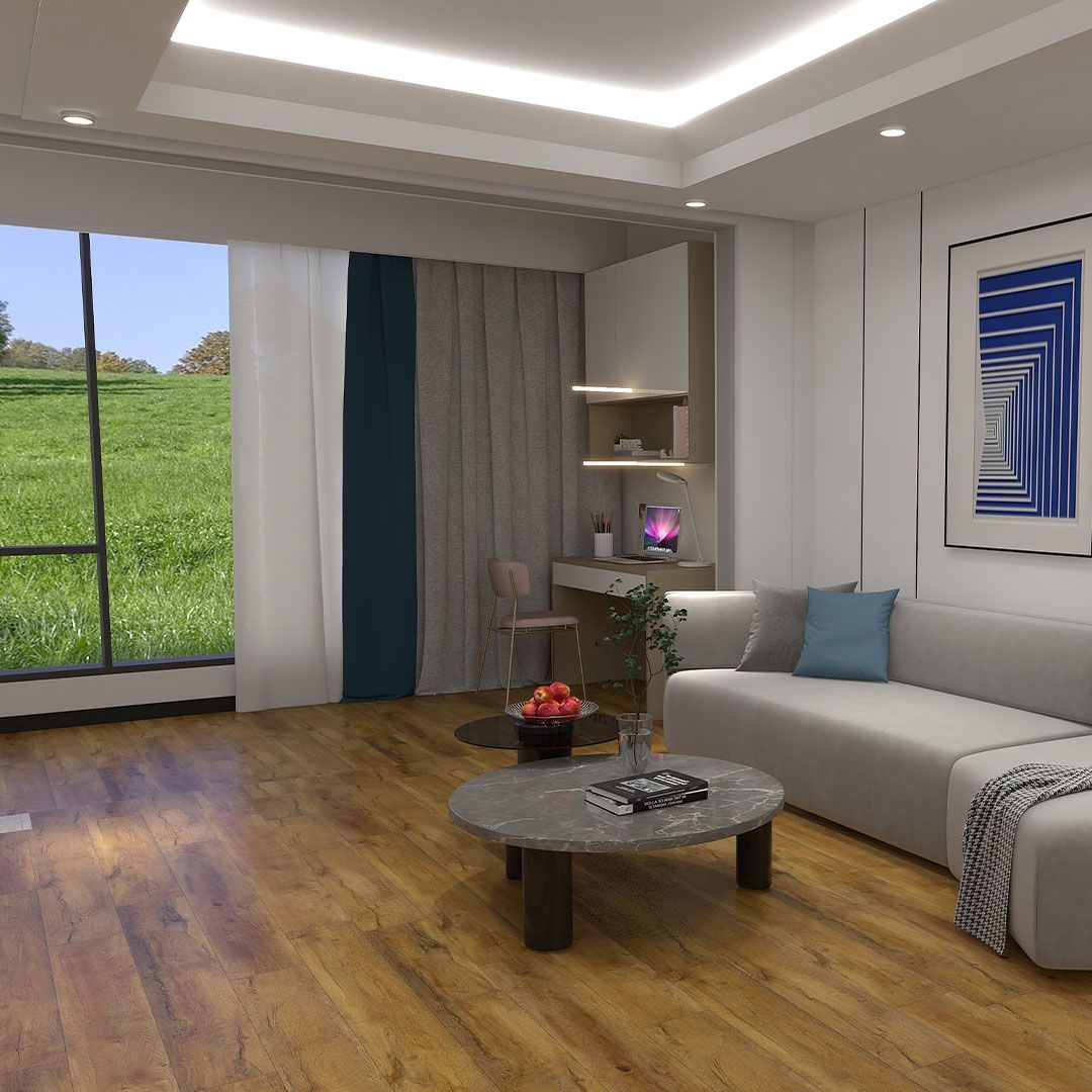 Living room with grey sectional sofa, wooden floor, and large window overlooking a green hill.