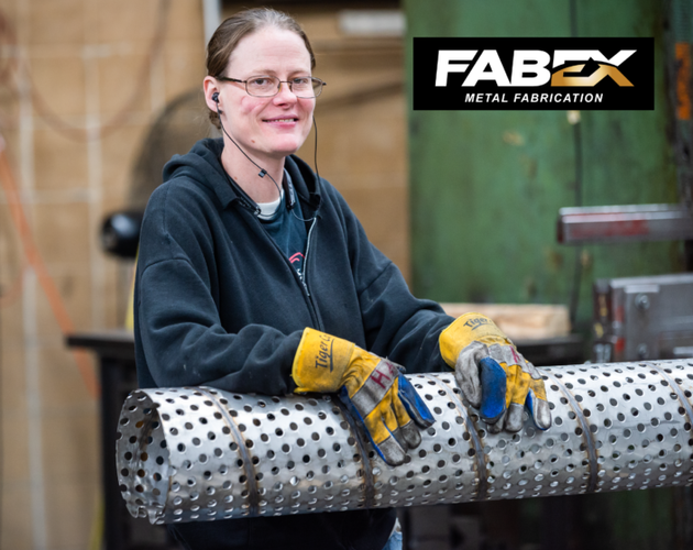 Fabx metal fabrication worker in gloves handling a perforated metal cylinder in a workshop