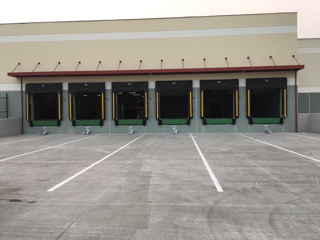 A row of loading docks are lined up in front of a building