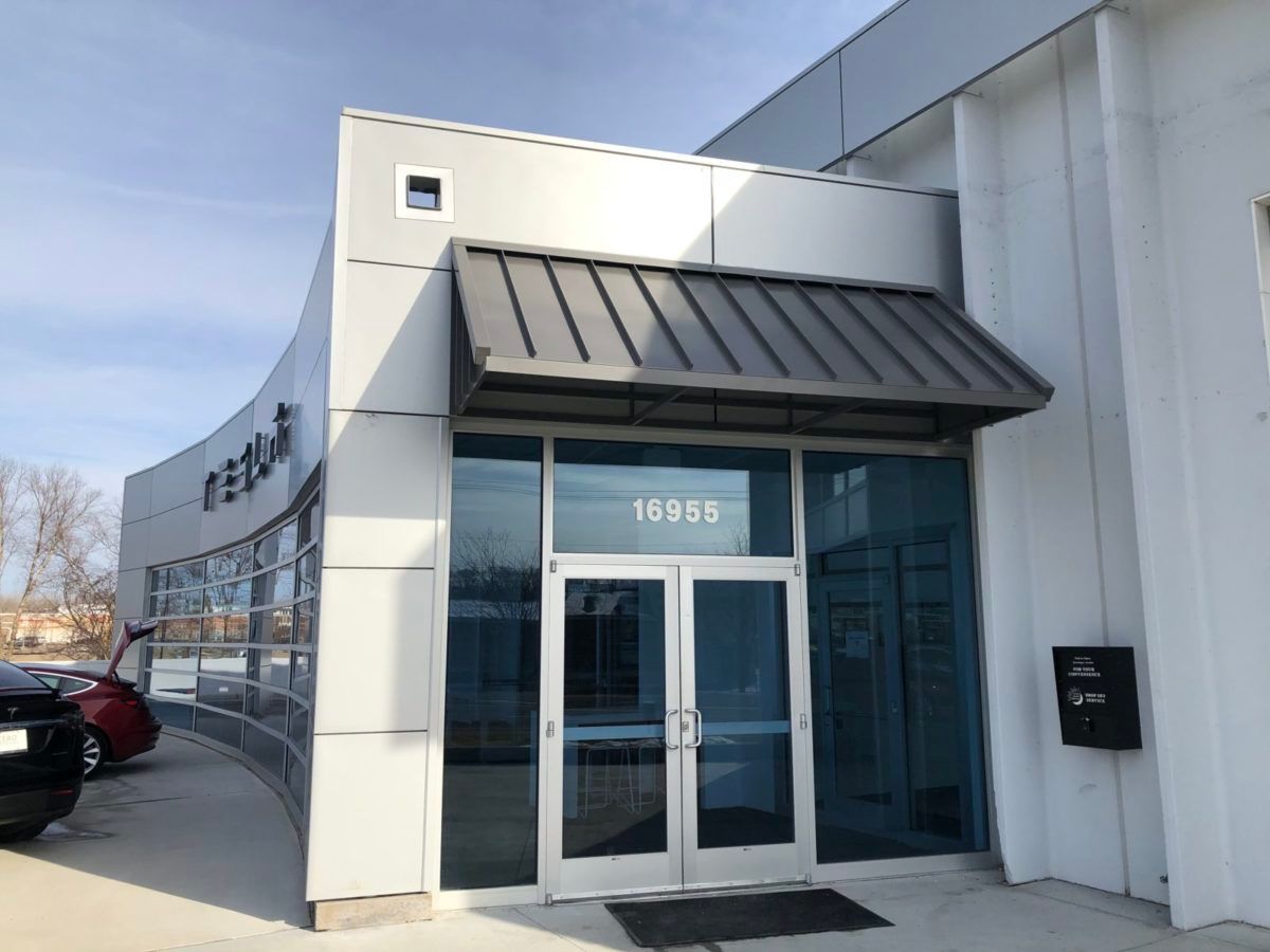 The front of a building with a canopy over the entrance.
