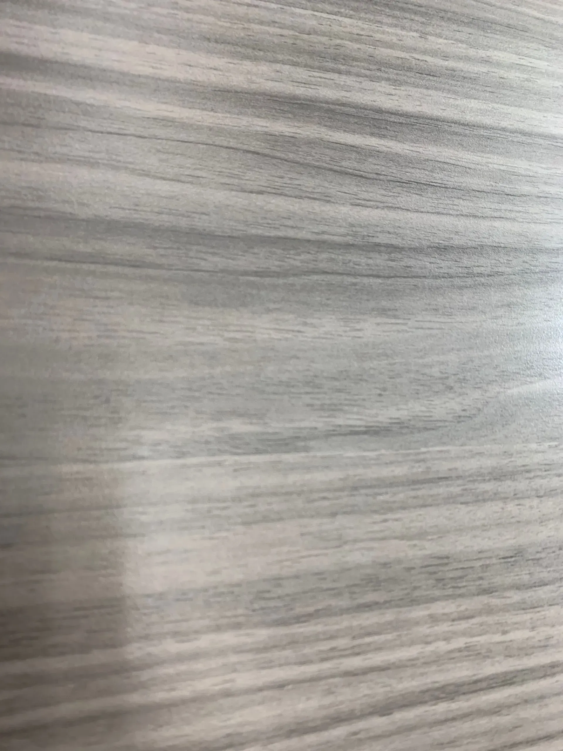 Light gray wood grain pattern.